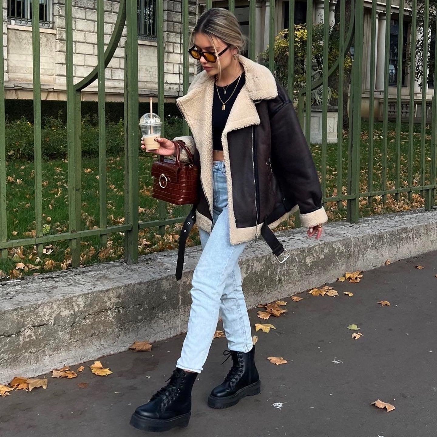 Veste longue en fourrure à multiples zips